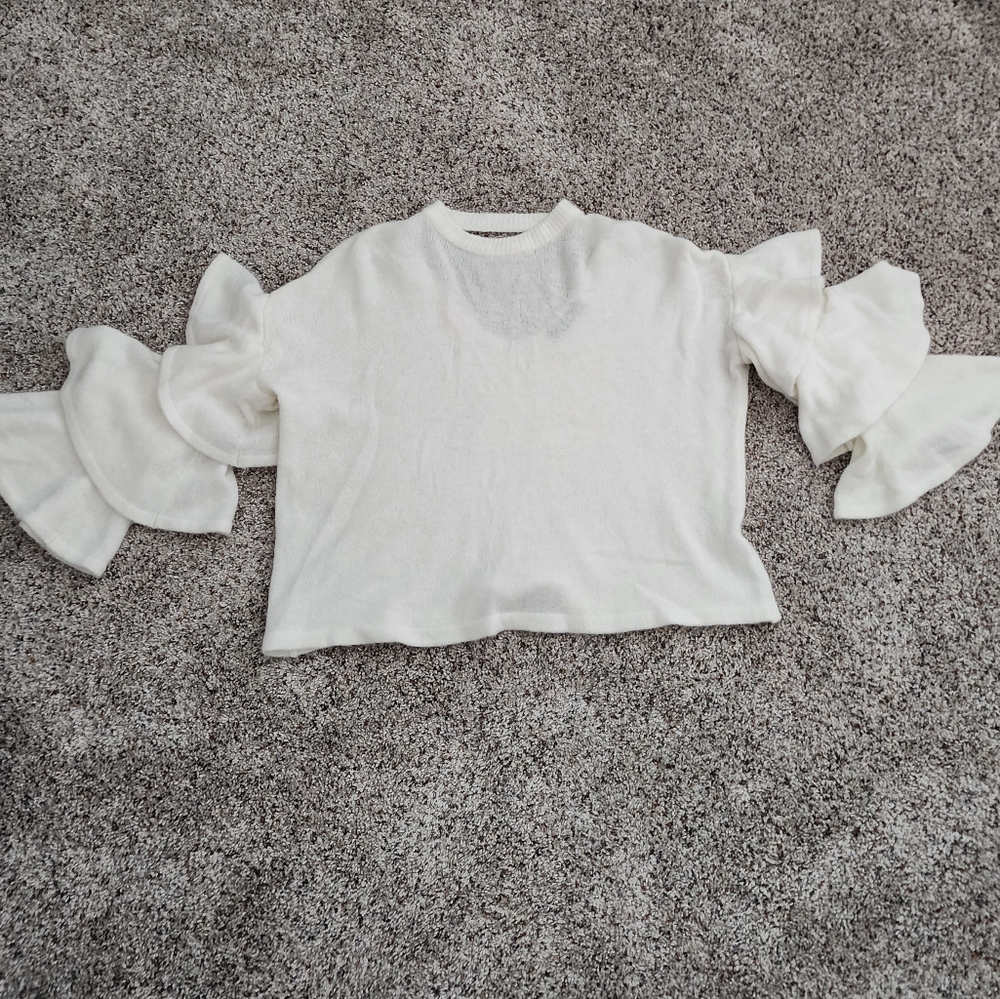 Cream sweater top with ruffle sleeve